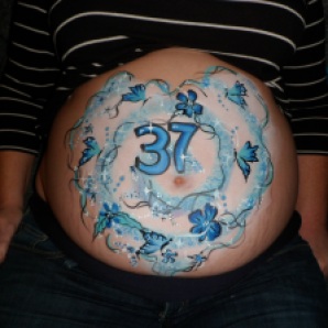 Blue butterflies and flowers heart baby bump painting at 37 weeks